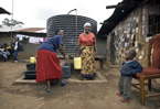 Women collecting water from a tank in the Kibera slums, Kenya. Women collecting water from a tank in the Kibera slums, Kenya.