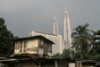 Luxury hotels and offices rise behind slum housing in centre of Malaysia. Mark Henley/Panos