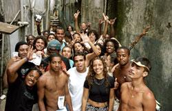 Changing meaning of cities and urban living: Nos do Cinema group posing for a picture at the end of shooting for the film in Favela da Rocinha. The organisation's objective is to promote social inclusion of youth in low-income neighbourhoods of Rio de Janeiro through cinema and technology. Photo credit: Eduardo Martino / Panos.