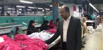 Mamunar in the garment factor Visiting a garment factory where the Ella Pad model is in place.