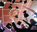 Graduation hats in the air Students celebrating graduation