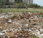 Pakistan waste Rubbish in an open area by a housing block in a part of Karachi, Pakistan.