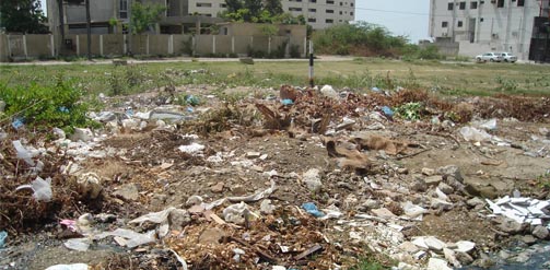 Rubbish in an open area by a housing block in a part of Karachi, Pakistan.