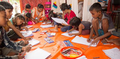 Rohingya children drawing pictures of what they witnessed in Burma.

 
Inside a UNICEF child friendly space, supported by UK aid, at Batukhali refugee camp in Bangladesh, art therapy and counselling help Rohingya children recover from the trauma they have experienced.

 
Photo credit: Anna Dubuis /DFID Flickr Creative Commons