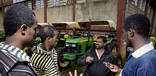 An Indian manager (in black jacket) in discussion with Ethiopian farm workers on a farm owned by Indian agribusiness company, Kanturi Global Limited. The company owns farms in Kenya and Ethiopia where they produce crops, especially flowers, for export. The acquisition of large tracts of land in Ethiopia is a prelude to a move into more general agricultural production.Credit: Petterik Wiggers / Panos