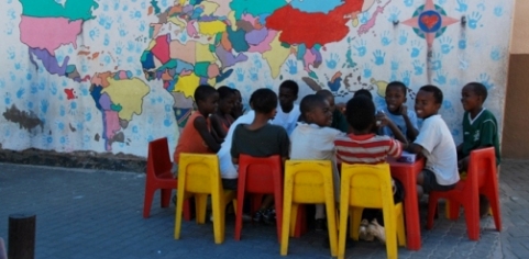 Children in discussion at an afterschool centre in the township on Katutura on the outskirts of Windhoek, Namibia. Credit: Barbara Cheney