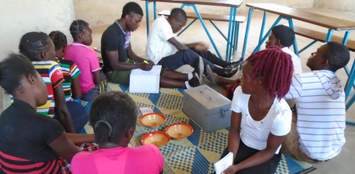 Young people participating in a youth savings group meeting, Zambia