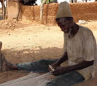 MVP Evaluation teaser image Man in village in Ghana making a fishing net