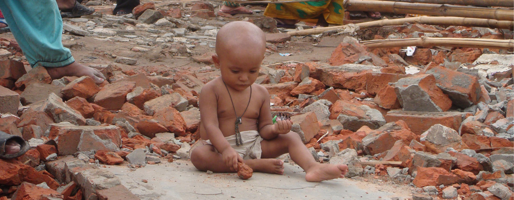'A child plays after the eviction of Sattala slum in Mohakhali, Dhaka' . Credit: Tareq Salahuddin on Flickr