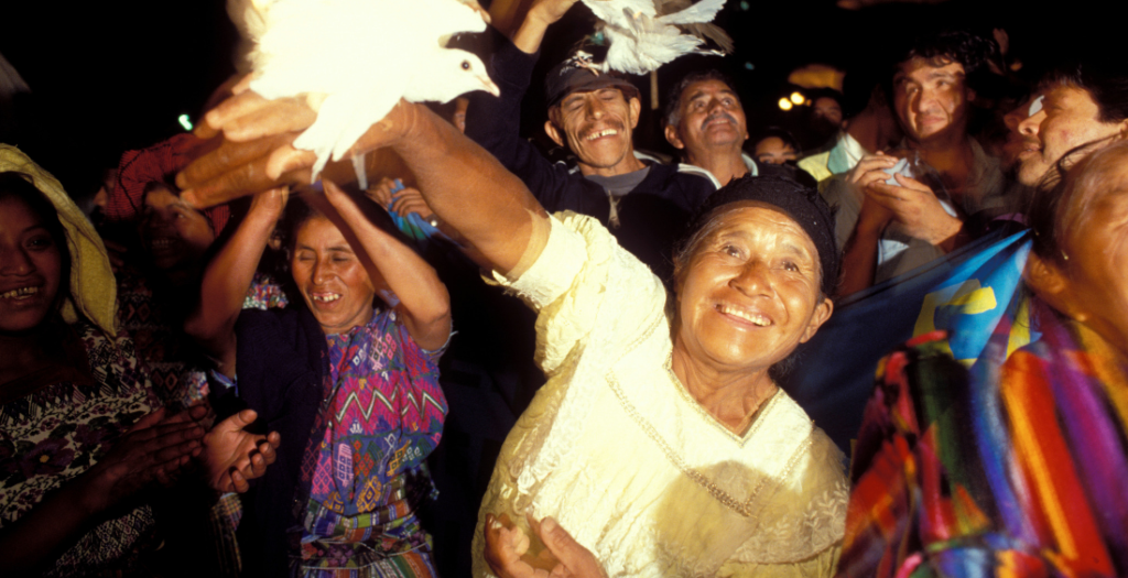 Releasing doves at a demonstration calling for the participation of the civil sector in the peace process.