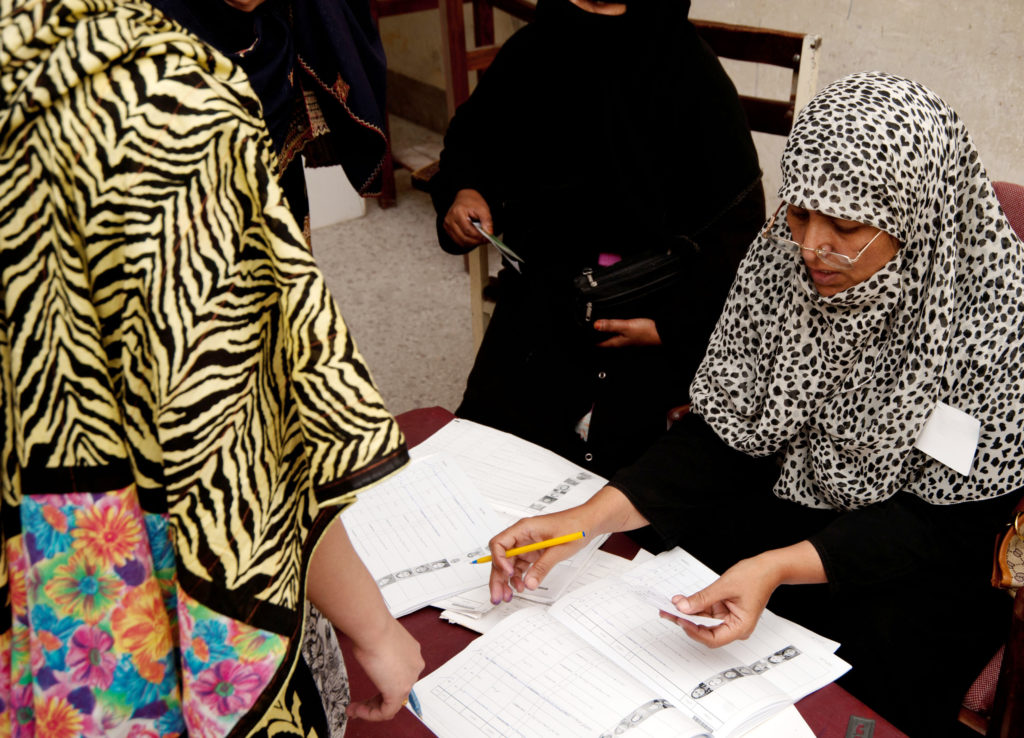 'A woman checks the electoral register during the 2013 elections in Pakistan'. Credit: Olaf Kellerhof.