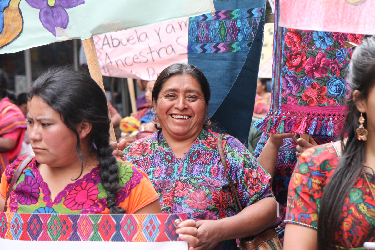 Guatemalan woman smiles at International Women's Day march