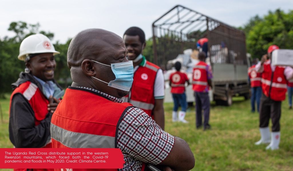 The Uganda Red Cross distribute support in the western Rwenzori mountains, which faced both the COVID-19 pandemic and floods in May 2020. Credit: Climate Centre.