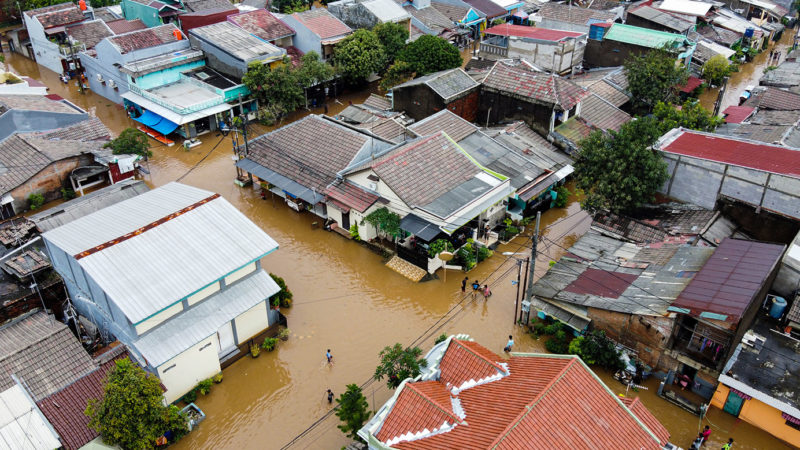 Birds eye view of flooded streets and devastation after massive natural disasters in Bekasi, Indonesia.