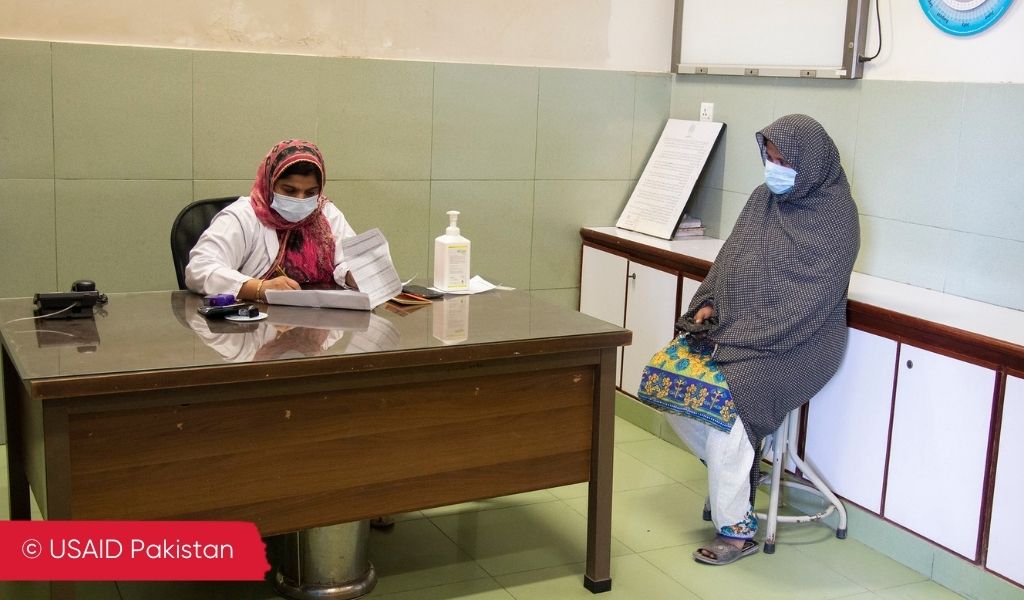 A female doctor and her female patient in a healthcare setting in Pakistan