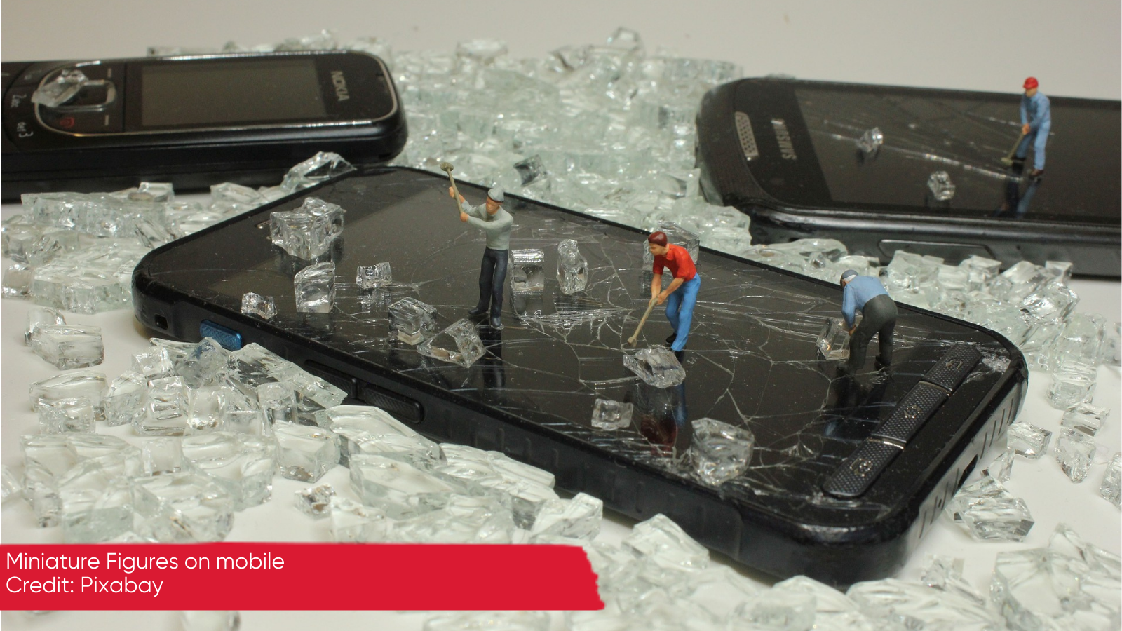 miniature figures mining on a mobile phone 