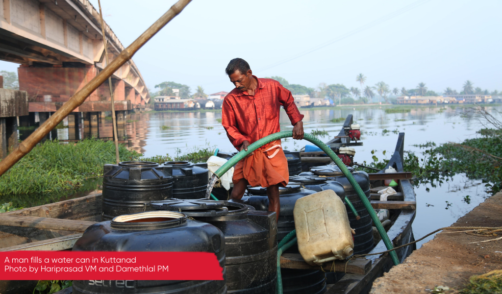 A man filling a water can in Kuttanad, Kerala