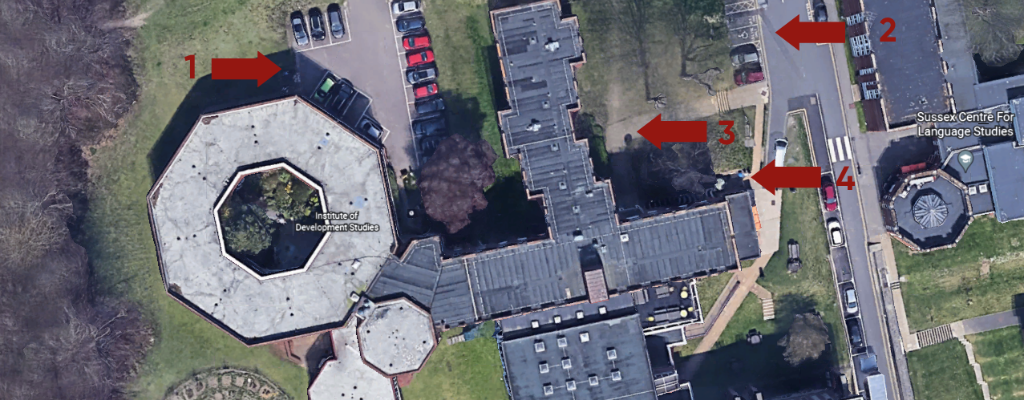 A birds eye view of the IDS building with arrows pointing to the parking facilities and building entrances