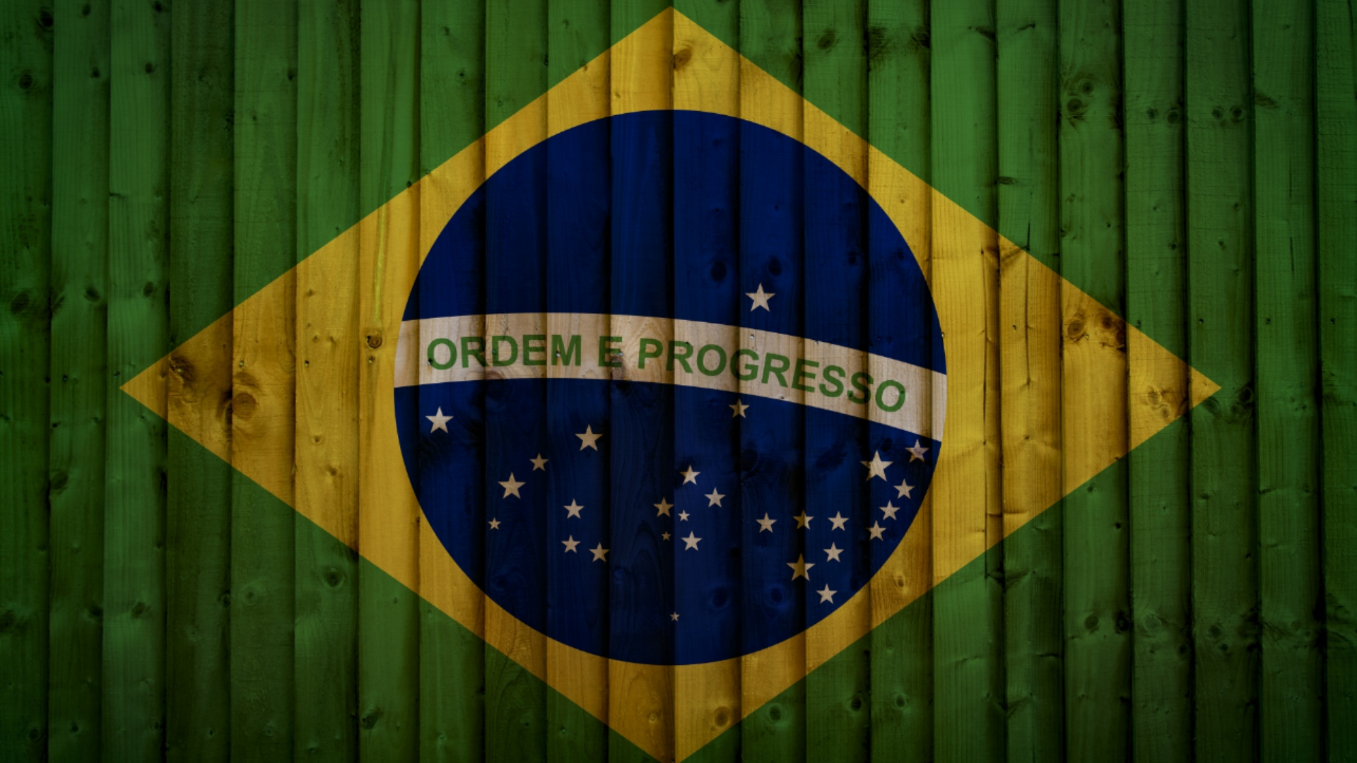 A photo of a fence with the Brazilian flag painted on