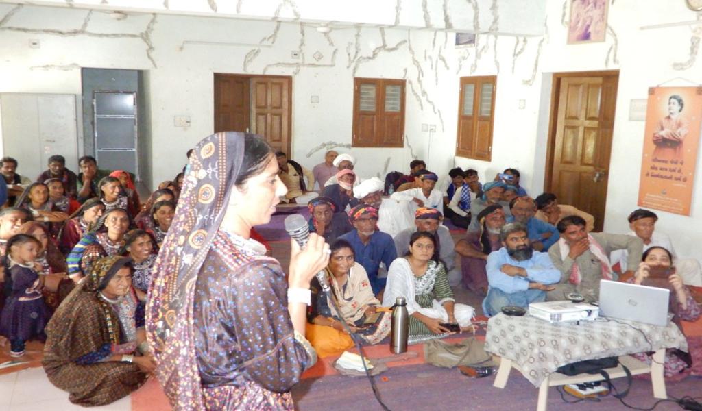 A Jat women participant presenting their photos and narratives in the community validation workshop 