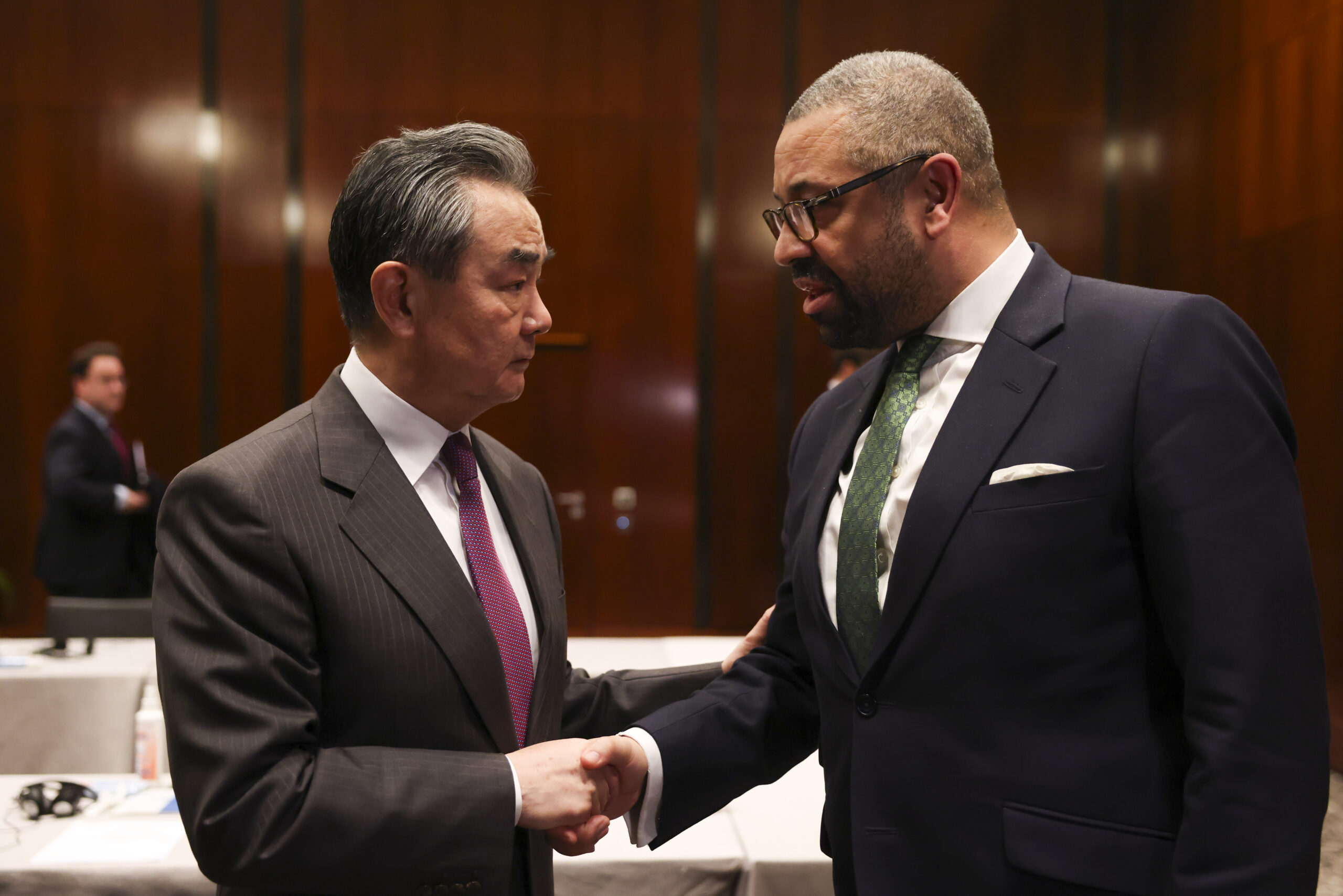 Foreign Secretary James Cleverly shakes hands with China Foreign Minister Wang Yi