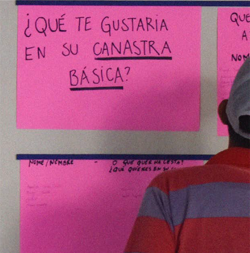 A person looks at signs on a board