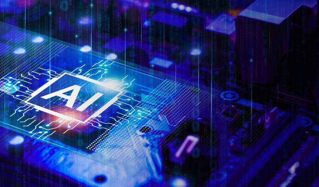 Close up of a computer microchip in a blue colour with white letters 'AI' placed over it.