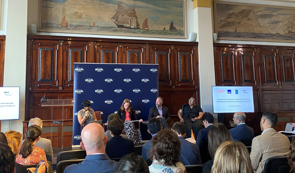Panel of speakers on a stage