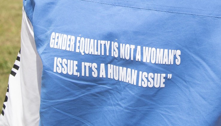 Text on the back of someone's jacket which reads, Gender equality is not a women's issue, its a human issue