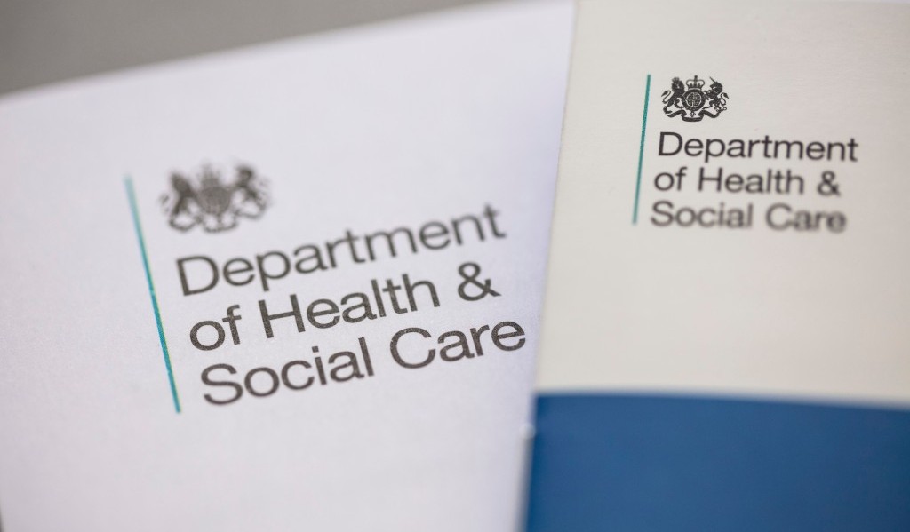 Close up of two reports overlapping each other, both showing the Department of Health and Social Care logo in the top left