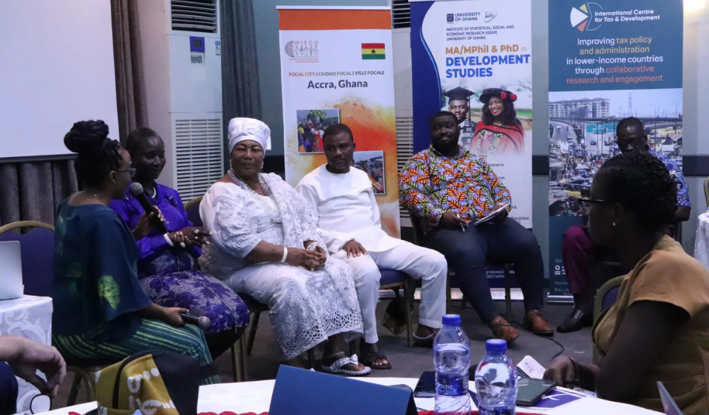 A panel of five speakers with three women, and two men, sitting and having a discussion.