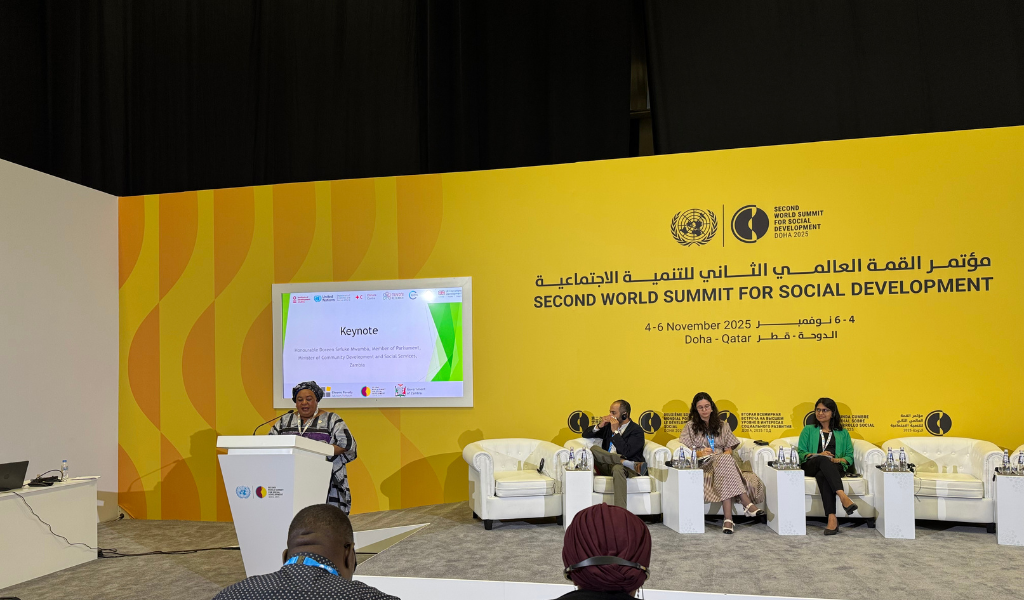 A panel of people speaking on stage at the world social summit 