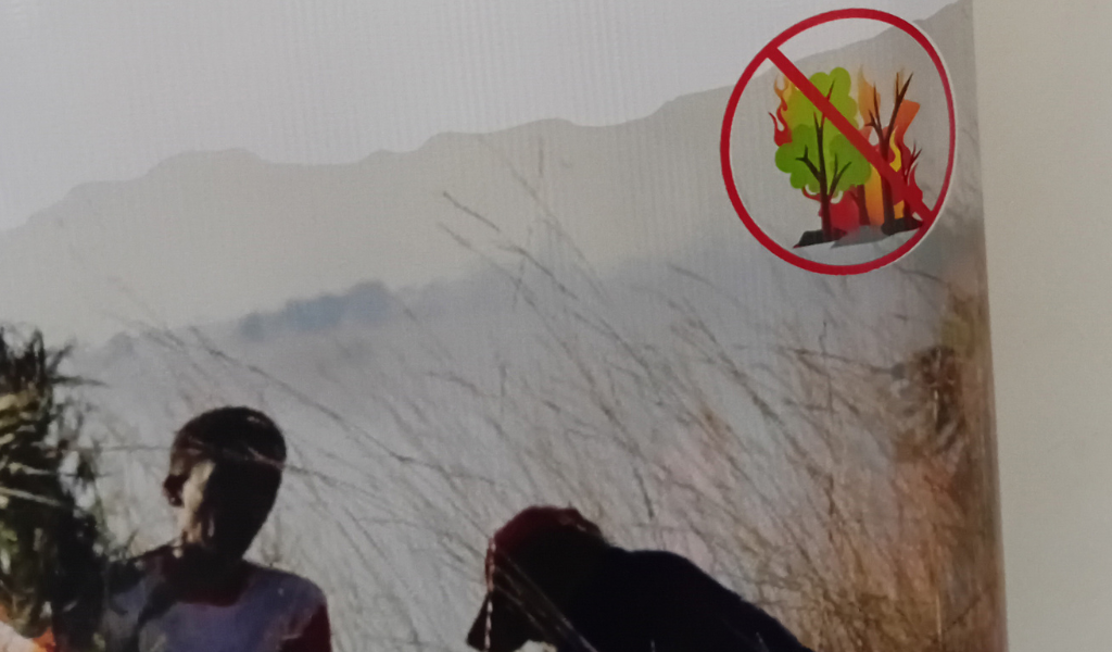 A banner at the event warning against the use of fire.